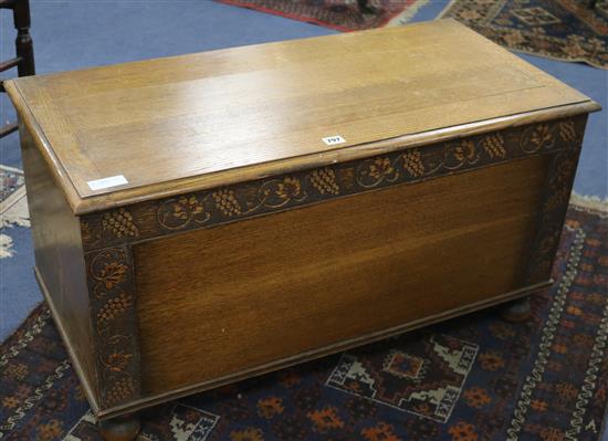 A carved oak coffer, W.91cm